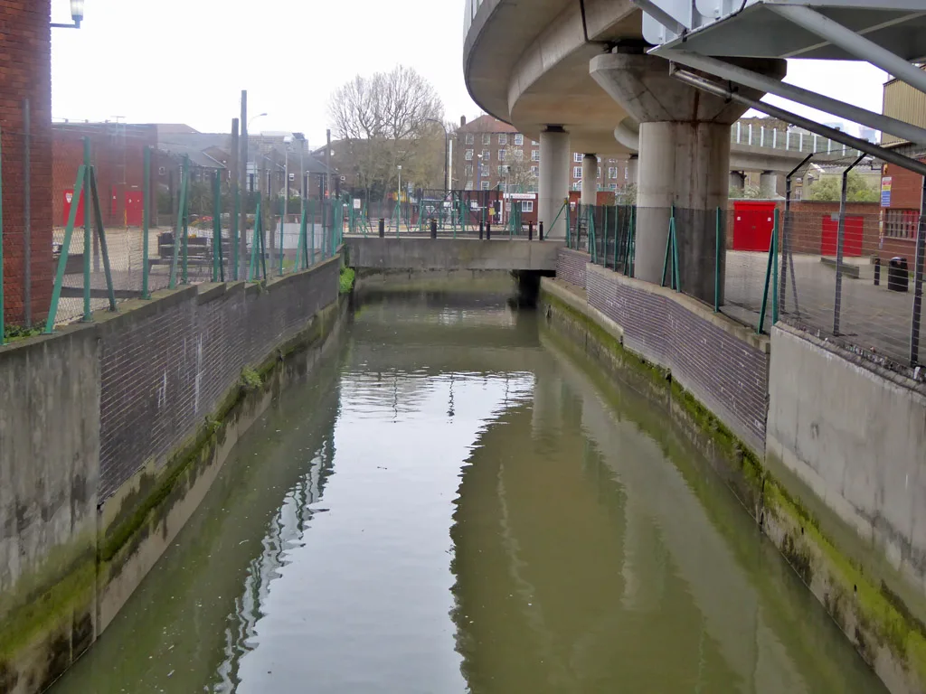 The Ravensbourne beneath the DLR at Deptford Bridge. The former college site runs along the river as it flows north into Deptford Creek